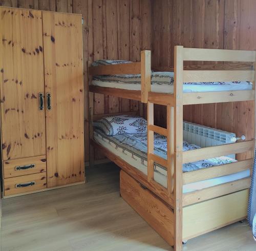 a bunk bed room with two bunk beds in a cabin at VILLA JAGODOVO Biały Dunajec in Biały Dunajec