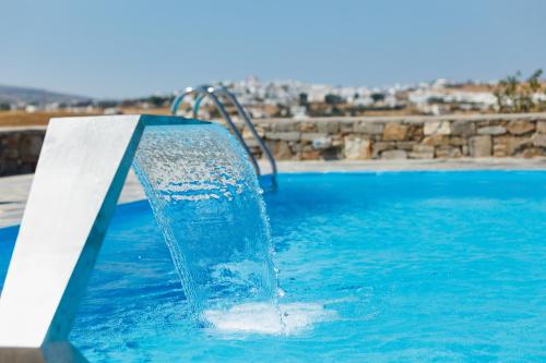 a water slide in a swimming pool at Punda Villas Paros in Kampos Paros
