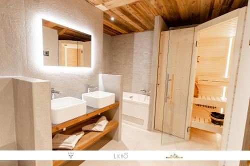 a bathroom with a sink and a mirror at Marmotte 205 - Splendide duplex aux pieds des pistes in Bonneval-sur-Arc