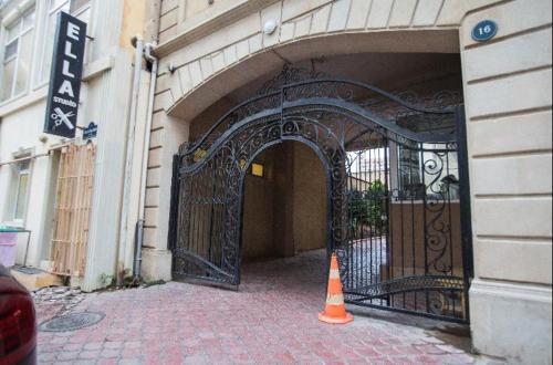 an entrance to a building with an iron gate at Leyla Apartments 1 in Baku