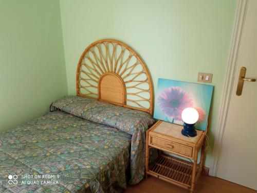 Postel nebo postele na pokoji v ubytování APARTAMENTOS RAMÓN