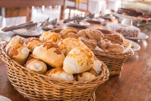 two baskets of pastries sitting on a table at Guarany Eco Resort in Monte Sião