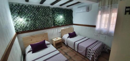 Llit o llits en una habitació de Cuencaloft Casa Vereda VUT