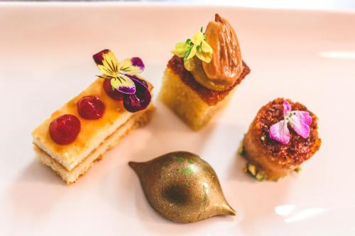 a plate of desserts on a white plate at Bunratty Manor Hotel in Bunratty