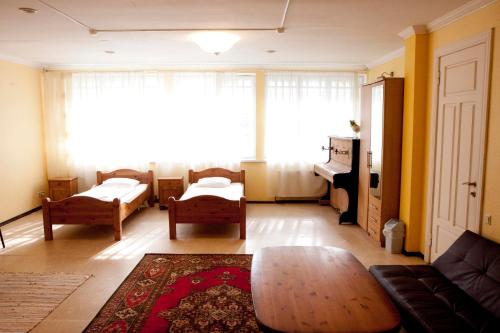 a living room with a couch and a table at Sun Shine Apartments in Jūrmala