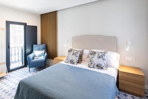 Ένα ή περισσότερα κρεβάτια σε δωμάτιο στο Apartamentos El Patio Plaza Mayor Cáceres