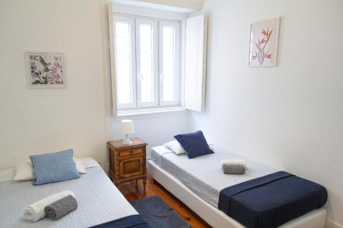 Postel nebo postele na pokoji v ubytování Guest House Amoreiras