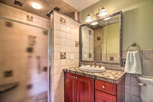 a bathroom with a sink and a shower at Vintage Schroon Lake Farmhouse w/ Private Beach! in Schroon Lake