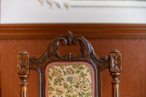 a bed frame with a floral pattern on it at Komodora nams in Liepāja