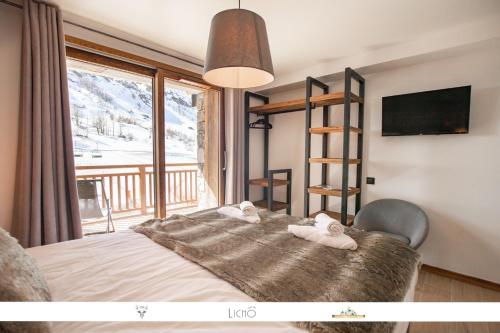 Vuode tai vuoteita majoituspaikassa Marmotte 103 - Luxueux appartement aux pieds des pistes