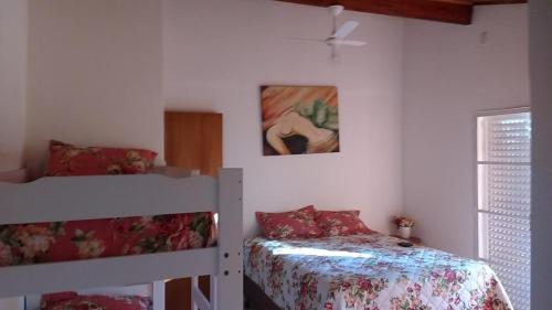 a bedroom with two bunk beds and a bed at Sitio Espelho Dagua - Brotas SP in Brotas