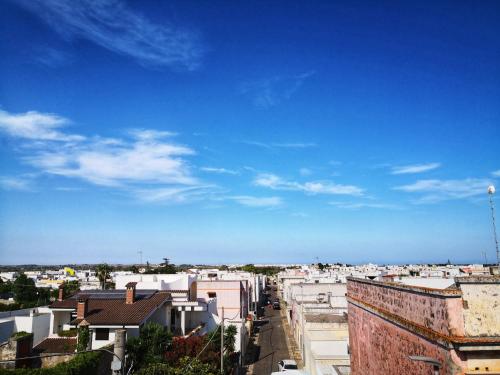 a view of a city with buildings and a blue sky at Le Strazzigne in Marittima