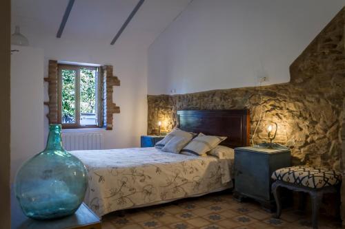 En eller flere senge i et værelse på Casa Rural Castillo JABUGO