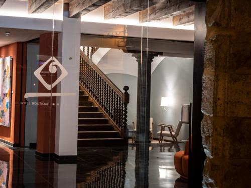 a hallway with a staircase in a building at Hotel Palacio La Marquesa 4 Estrellas SUP in Teruel