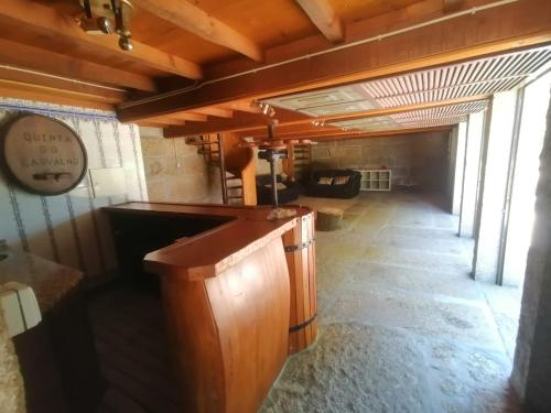 an empty room with a bar in a building at Quinta do Carvalho - Nature Guest Houses in Guimarães