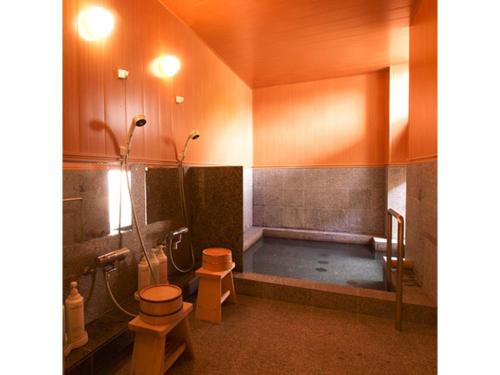 a bathroom with a tub and a toilet and a sink at Pure Hotel - Vacation STAY 44185v in Yabu