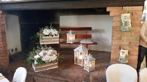 a room with flowers and lanterns on a table at Agriturismo San Galgano in Chiusdino