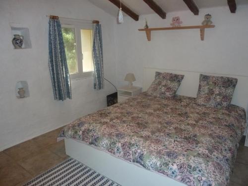 מיטה או מיטות בחדר ב-Villa Les Oliviers