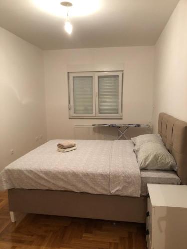 Ένα ή περισσότερα κρεβάτια σε δωμάτιο στο Apartman Mila