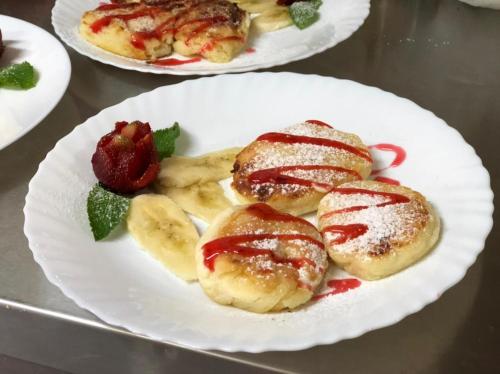 three plates of pastries and strawberries on a table at Шервуд in Myta
