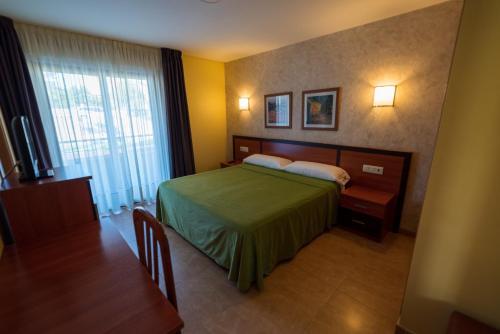 Кровать или кровати в номере Hotel Atlántico Sanxenxo