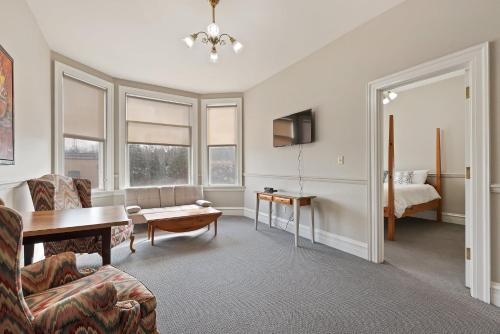 a living room with a couch and a table at The Audubon Inn LLC in Mayville