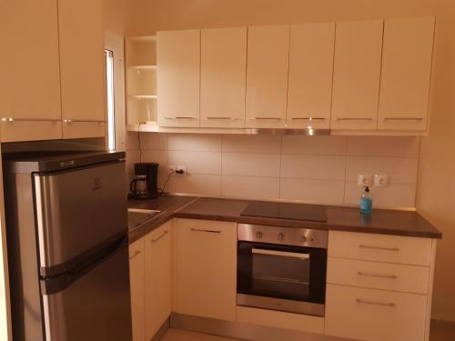 Η κουζίνα ή μικρή κουζίνα στο Venus Sea View Apartment