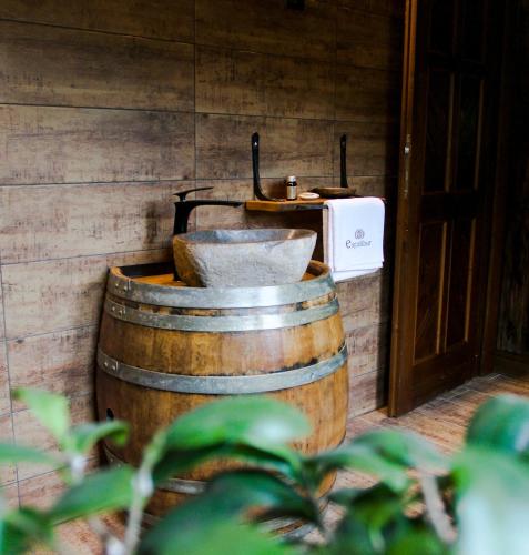 a large wooden barrel with a sink and a toaster at Excalibur miniHotel in Eger