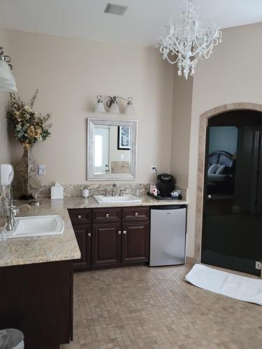 a large bathroom with a sink and a mirror at The Inn at 161 in Sutter Creek