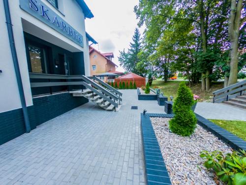 Zahrada ubytování Skarbek Iława, pokoje i apartamenty
