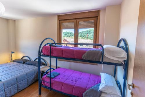 Postel nebo postele na pokoji v ubytování Albergue de Prioro