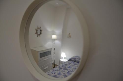 Postel nebo postele na pokoji v ubytování Casa Vacanza AMARE MONDELLO