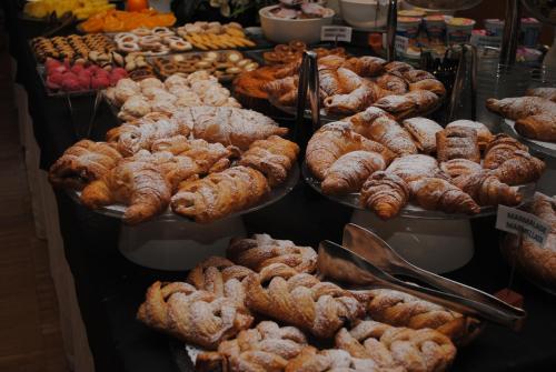 a display of different types of pastries in a bakery at Schio Hotel in Schio