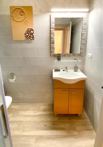 a bathroom with a sink and a mirror at Casa l'Escorretger in Calaceite