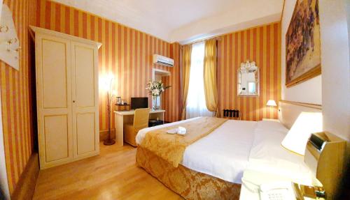 Postel nebo postele na pokoji v ubytování Hotel Corte dei Greci