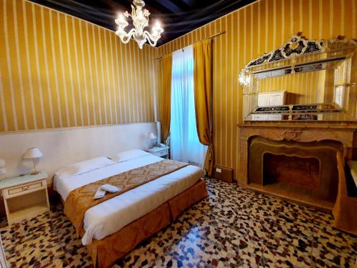 Postel nebo postele na pokoji v ubytování Hotel Corte dei Greci