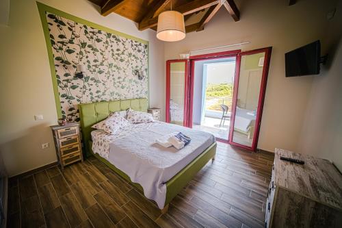 Postel nebo postele na pokoji v ubytování Olive Tree Suites