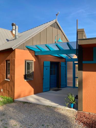 a large building with a blue roof at Eden's Echoes Country Retreat in Blacksburg