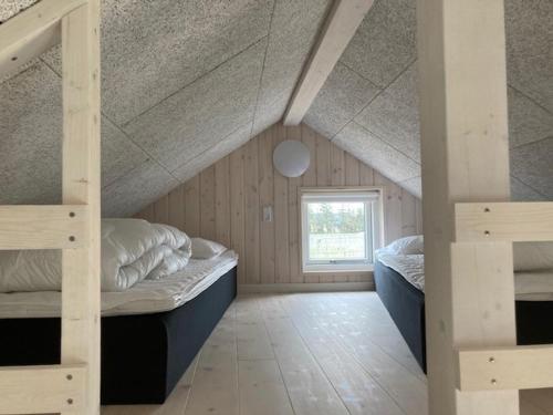 Postel nebo postele na pokoji v ubytování Gl. Klitgaard Camping & Cottages