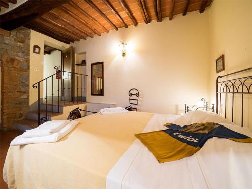 Tempat tidur dalam kamar di Paradiso in Chianti
