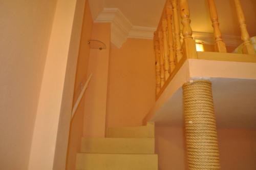 a stairway with a spiral stair case and a spiral stair casengthngthngth at Studio Mezzanine Kasbah Tanger - Climatise in Tangier
