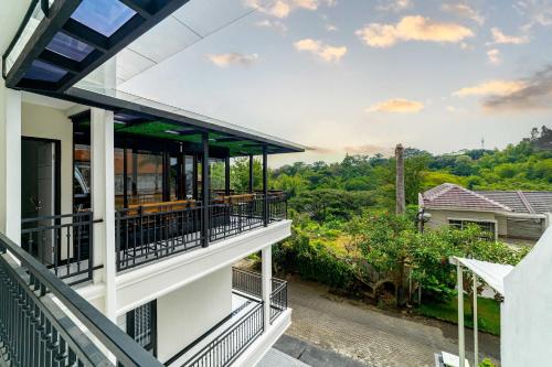 a view from the balcony of a house at Tree Homestay Mitra RedDoorz in Kasri