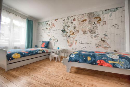 En eller flere senge i et værelse på L’Ancre des falaises - MAISON VUE MER & À 50M PLAGE (hypercentre)