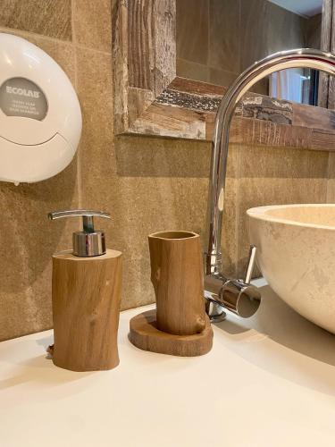 a bathroom counter with a sink and a sink at Gradina Forest Villas in Sozopol