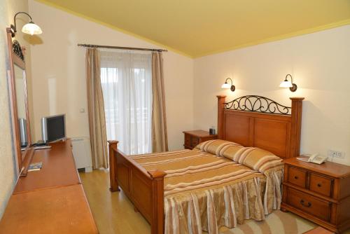 Rúm í herbergi á Hotel Venezia Imotski