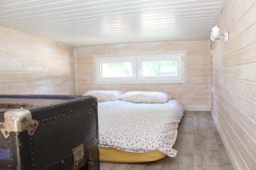 Postel nebo postele na pokoji v ubytování tinyhouse-dangast 1