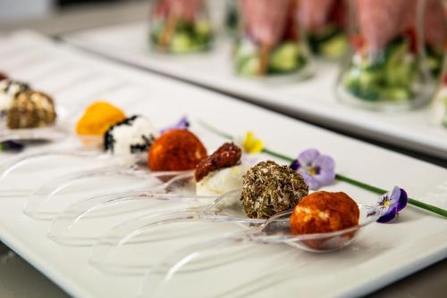 a white plate topped with different types of desserts at Geraniotis Hotel and Resort in Plataniás