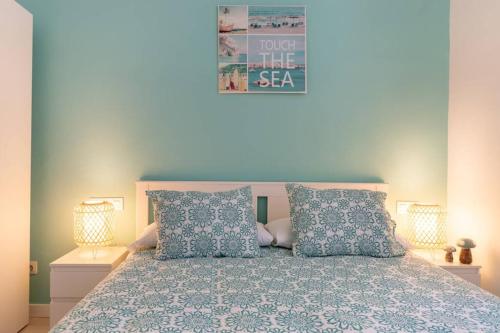 a bedroom with a bed with two pillows at Old Town IV by Next Stop Bilbao in Bilbao