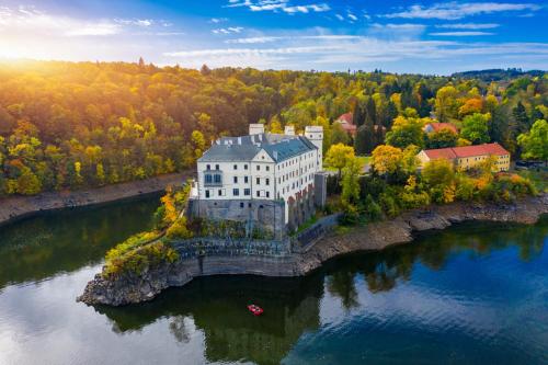an aerial view of a building on an island in the water at Novohradská in České Budějovice