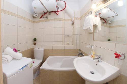 Kúpeľňa v ubytovaní "Hermes" central apartment